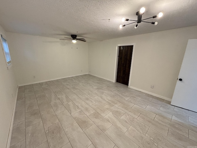 11220 Bainbridge Dr, Little Rock, AR 72212 - empty room featuring a textured ceiling, a chandelier, and ceiling fan
