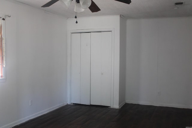 4406 W 16th Ave, Pine Bluff, AR 71603 - unfurnished bedroom featuring dark wood-style floors, a closet, and ceiling fan