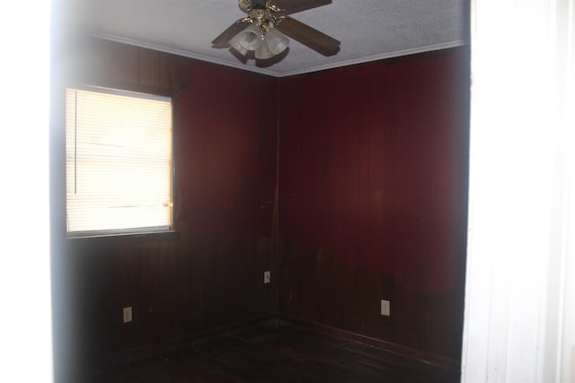4406 W 16th Ave, Pine Bluff, AR 71603 - spare room featuring ornamental molding, dark wood-type flooring, and ceiling fan