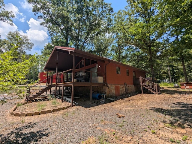 100 Osage, Edgemont, AR 72044 - rear view of property with stairway and a deck