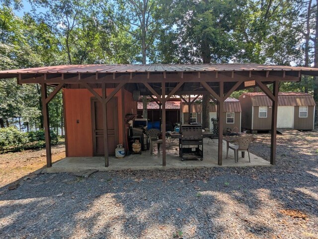 100 Osage, Edgemont, AR 72044 - view of patio / terrace featuring a storage unit