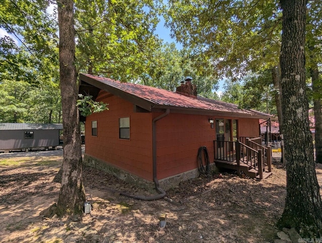 100 Osage, Edgemont, AR 72044 - view of property exterior featuring a metal roof and a chimney