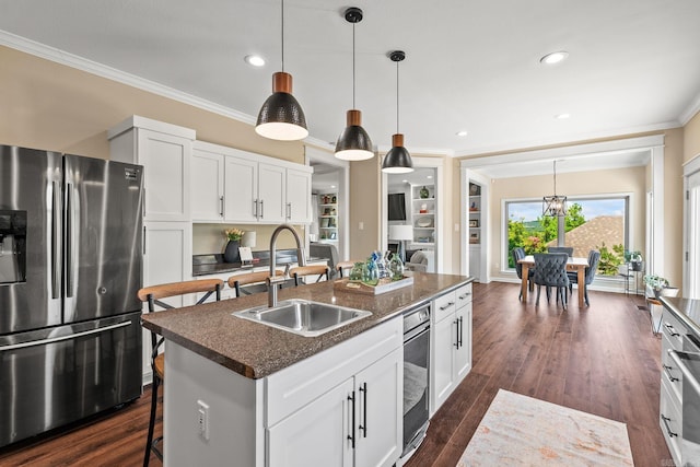 18 Calumet Rd, Little Rock, AR 72223 - kitchen featuring stainless steel refrigerator with ice dispenser, crown molding, a breakfast bar, white cabinets, and pendant lighting