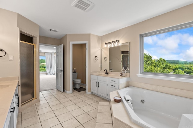 18 Calumet Rd, Little Rock, AR 72223 - bathroom featuring vanity, a tub with jets, a stall shower, and tile patterned flooring