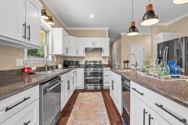 18 Calumet Rd, Little Rock, AR 72223 - kitchen featuring stainless steel appliances, crown molding, white cabinetry, dark wood-type flooring, and pendant lighting