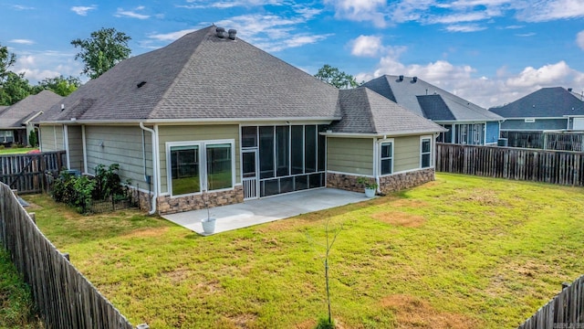 4321 Sloan Dr, Bryant, AR 72002 - back of property with stone siding, a patio area, a sunroom, and a shingled roof