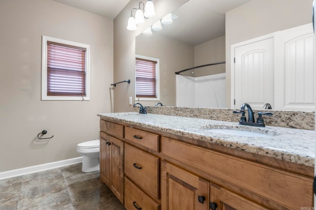 18720 Lochridge Dr, Little Rock, AR 72210 - bathroom with double vanity, a shower, and stone finish floors