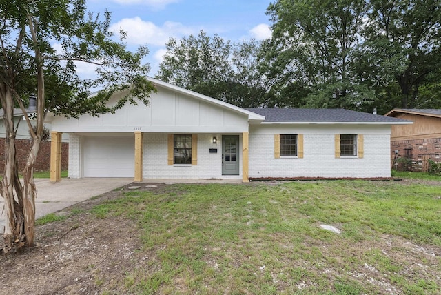 1495 Manor St, Conway, AR 72034 - single story home with brick siding, a garage, and a front yard