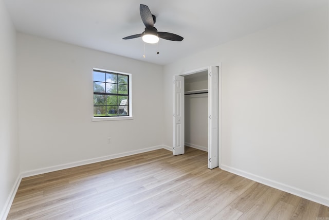 1495 Manor St, Conway, AR 72034 - unfurnished bedroom featuring light wood finished floors, a closet, and a ceiling fan