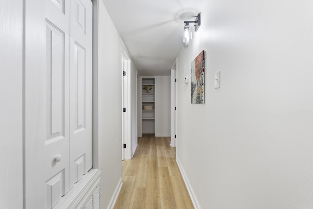 1495 Manor St, Conway, AR 72034 - hallway featuring light wood-style floors and baseboards