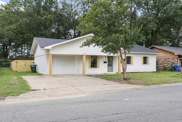 1495 Manor St, Conway, AR 72034 - ranch-style house featuring a garage, brick siding, driveway, and a shingled roof