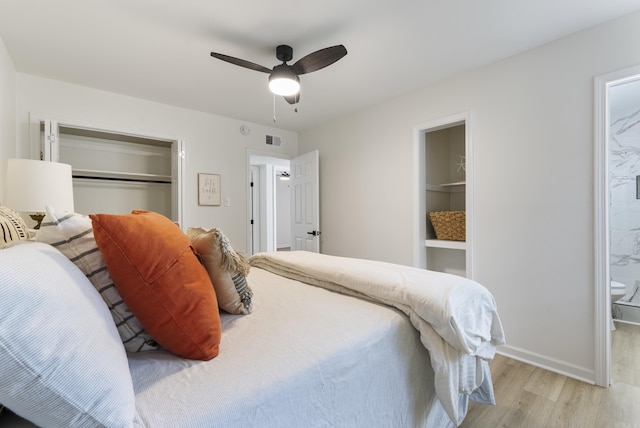 1495 Manor St, Conway, AR 72034 - bedroom featuring light wood-type flooring, a closet, a ceiling fan, and connected bathroom
