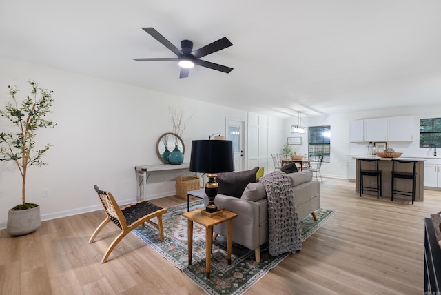 1495 Manor St, Conway, AR 72034 - living room featuring light wood-style floors and ceiling fan
