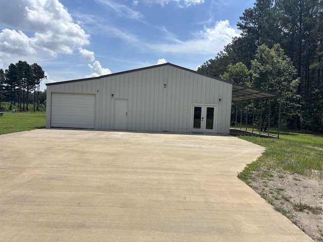 225 Donnie Holt Rd, Mcrae, AR 72102 - garage featuring french doors, a garage, and driveway