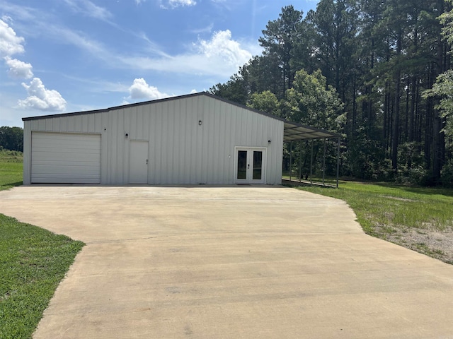 225 Donnie Holt Rd, Mcrae, AR 72102 - garage featuring french doors and a garage