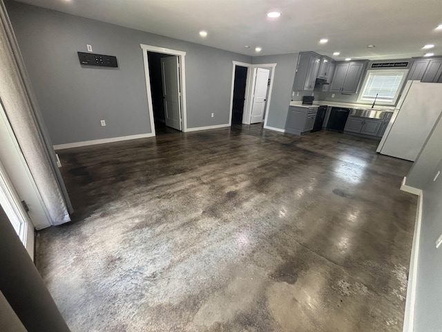 225 Donnie Holt Rd, Mcrae, AR 72102 - kitchen with gray cabinetry, freestanding refrigerator, finished concrete floors, recessed lighting, and light countertops
