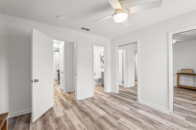 301 Kings Row Dr Unit 106, Little Rock, AR 72207 - unfurnished bedroom featuring light wood-style floors, ceiling fan, and ensuite bathroom