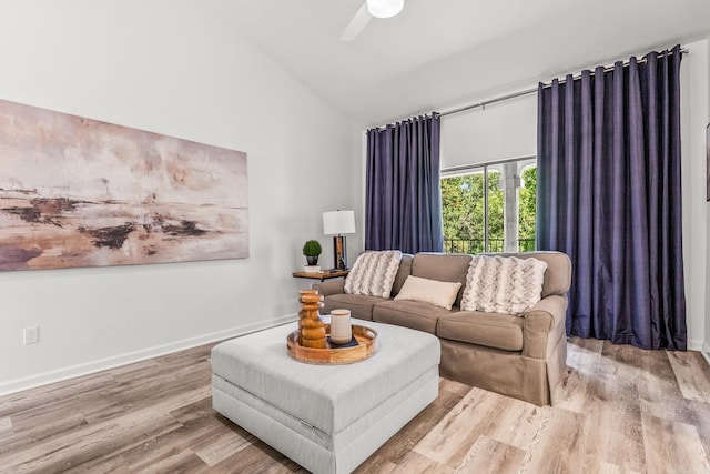 301 Kings Row Dr Unit 106, Little Rock, AR 72207 - living room with wood finished floors, ceiling fan, and high vaulted ceiling