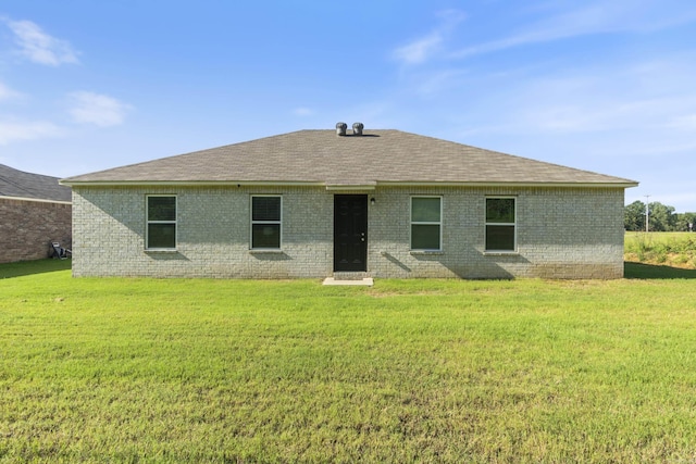 1040 Gallery Dr, Conway, AR 72032 - back of property with brick siding, a lawn, and a shingled roof