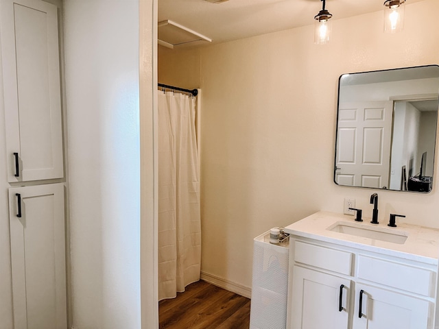 702 Polk Road 57, Mena, AR 71953 - bathroom with wood finished floors, vanity, and a shower with curtain