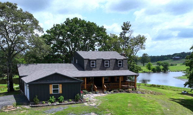 702 Polk Road 57, Mena, AR 71953 - view of front of house featuring a porch, a water view, a front lawn, board and batten siding, and a chimney