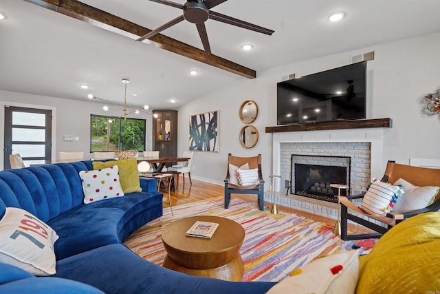 1113 Twin Points Rd, Hot Springs, AR 71913 - living area featuring light wood-type flooring, a ceiling fan, beam ceiling, a fireplace, and recessed lighting