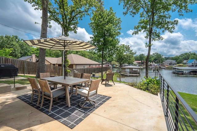1113 Twin Points Rd, Hot Springs, AR 71913 - fenced backyard with outdoor dining space, a water view, and a patio area