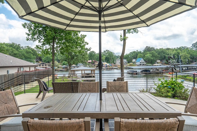 1113 Twin Points Rd, Hot Springs, AR 71913 - wooden terrace with outdoor dining area, a water view, and view of scattered trees