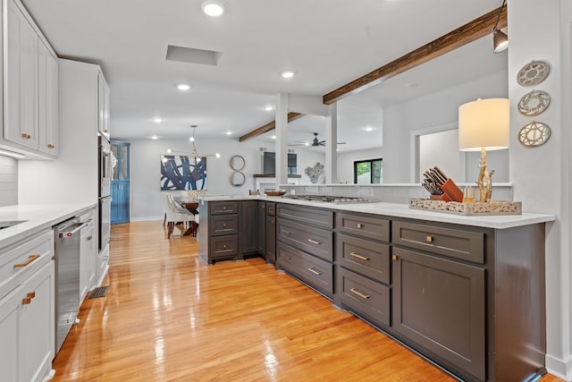 1113 Twin Points Rd, Hot Springs, AR 71913 - kitchen featuring beamed ceiling, white cabinetry, appliances with stainless steel finishes, decorative backsplash, and light wood-style floors