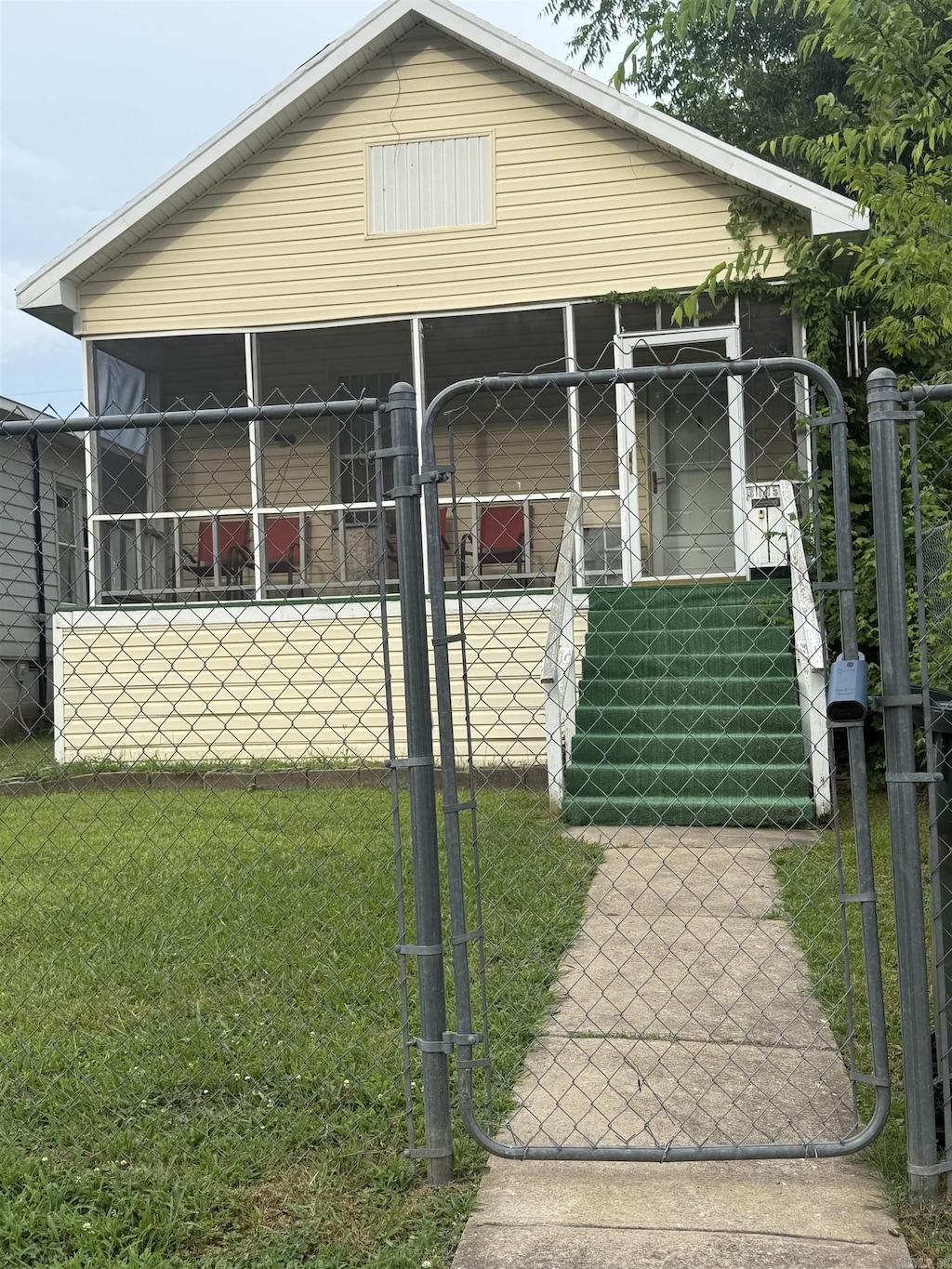 view of front of home featuring a gate and covered porch