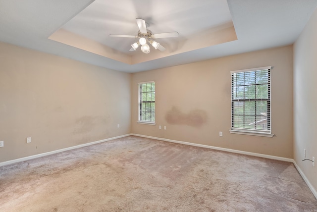 53 E Main St, Greenbrier, AR 72058 - carpeted spare room with a tray ceiling, healthy amount of natural light, and a ceiling fan
