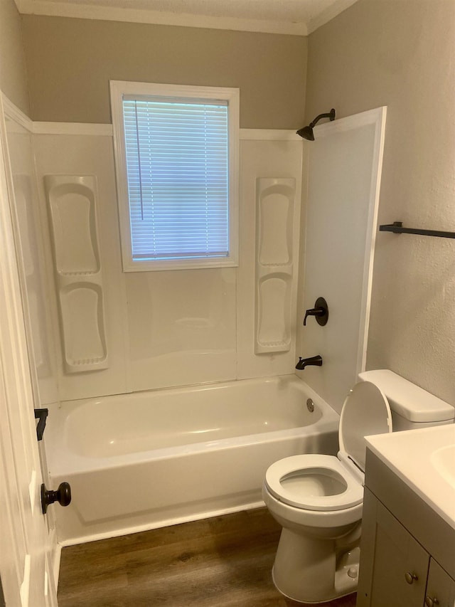 134 S Gosnell St, Gosnell, AR 72315 - full bathroom with ornamental molding, vanity, wood finished floors, and  shower combination