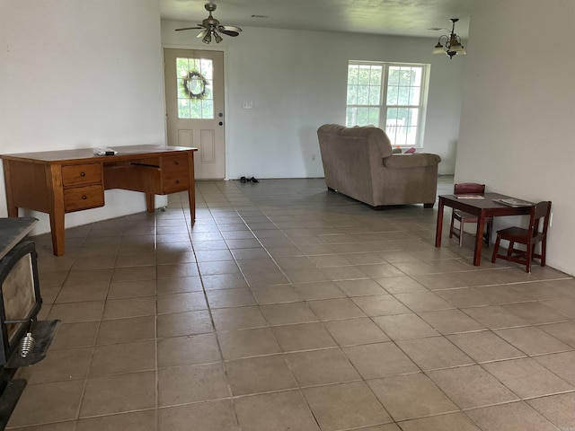 497 Ben Rd, Drasco, AR 72530 - living area featuring light tile patterned flooring, healthy amount of natural light, ceiling fan, and a chandelier