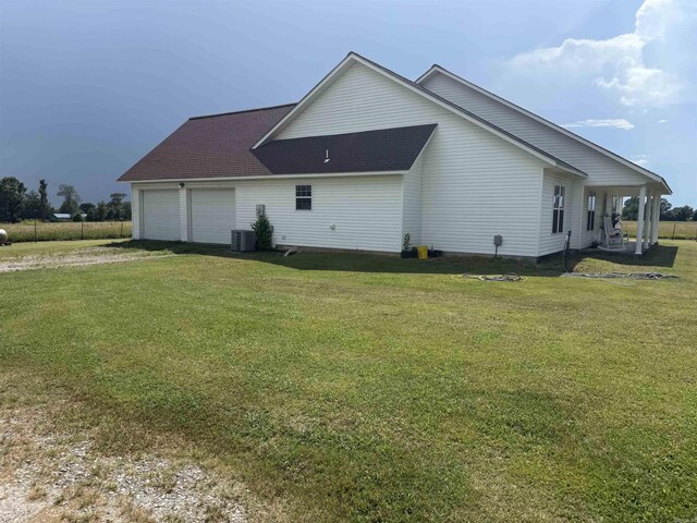 497 Ben Rd, Drasco, AR 72530 - view of property exterior featuring dirt driveway, a garage, and a lawn