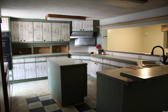 196 Stone Mountain Rd, Vilonia, AR 72032 - kitchen featuring a kitchen island, tile patterned floors, under cabinet range hood, and a peninsula