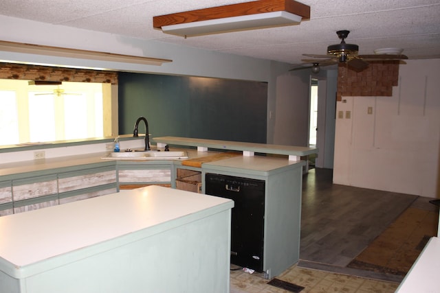 196 Stone Mountain Rd, Vilonia, AR 72032 - kitchen featuring dishwasher, ceiling fan, light countertops, a kitchen island, and light floors