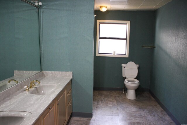 196 Stone Mountain Rd, Vilonia, AR 72032 - bathroom featuring double vanity and toilet