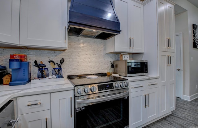 226 Shamsie Ln, White Hall, AR 71602 - kitchen with stainless steel appliances, extractor fan, tasteful backsplash, and white cabinetry