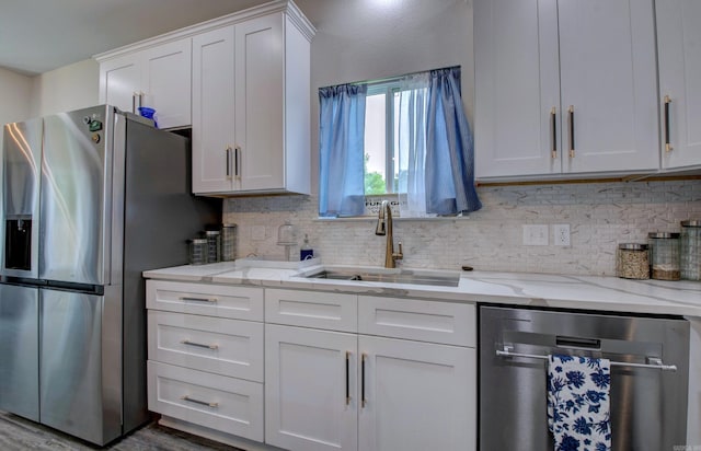 226 Shamsie Ln, White Hall, AR 71602 - kitchen with stainless steel appliances, backsplash, white cabinets, and light stone counters