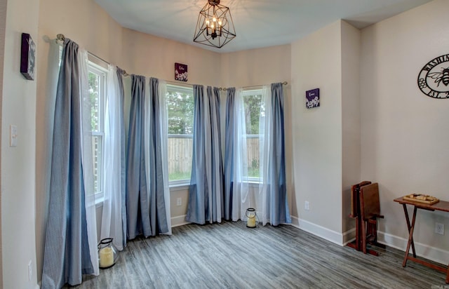 226 Shamsie Ln, White Hall, AR 71602 - unfurnished room featuring wood finished floors and a chandelier