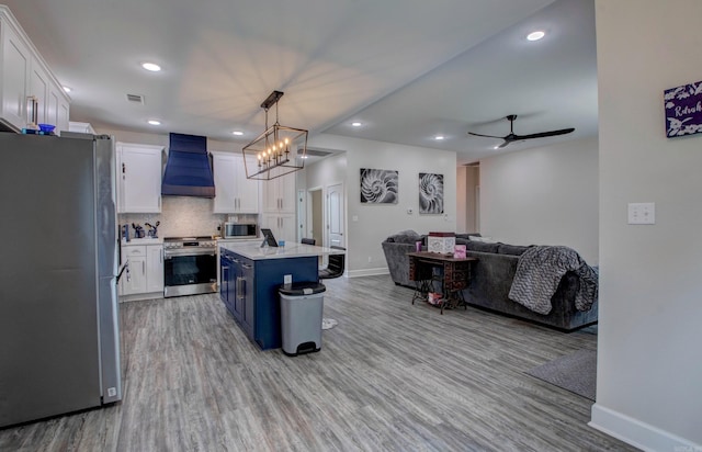 226 Shamsie Ln, White Hall, AR 71602 - kitchen featuring stainless steel appliances, premium range hood, open floor plan, light wood finished floors, and recessed lighting