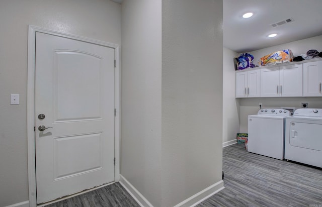 226 Shamsie Ln, White Hall, AR 71602 - washroom featuring cabinet space, wood finished floors, and independent washer and dryer