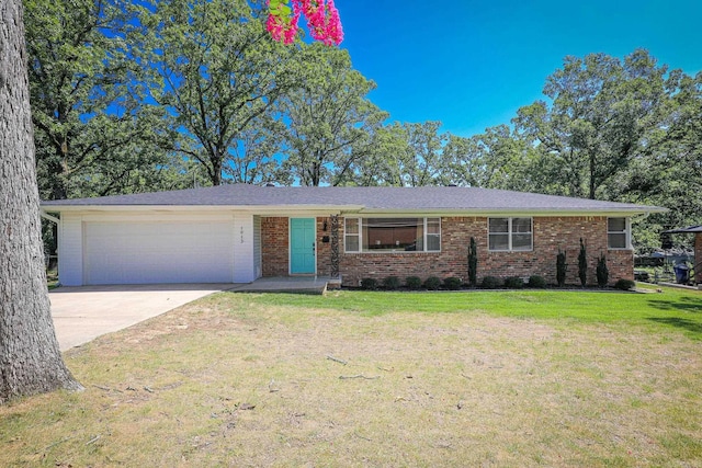 1913 Topf Rd, North Little Rock, AR 72116 - ranch-style home with an attached garage, driveway, brick siding, and a front yard