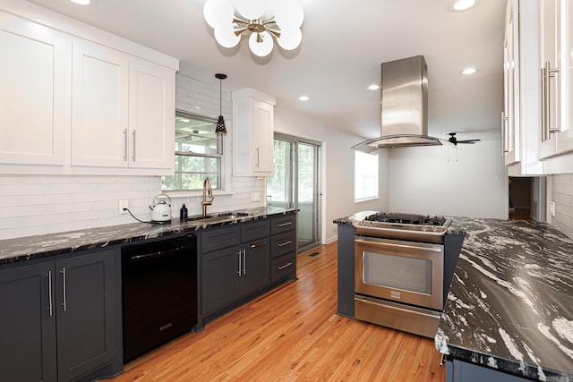1913 Topf Rd, North Little Rock, AR 72116 - kitchen with dishwasher, island range hood, stainless steel range with gas cooktop, white cabinetry, and backsplash