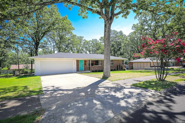1913 Topf Rd, North Little Rock, AR 72116 - ranch-style home featuring brick siding, an attached garage, a front lawn, and driveway