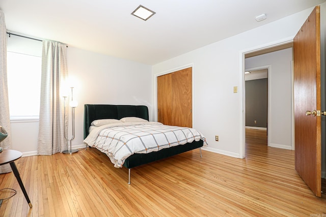 1913 Topf Rd, North Little Rock, AR 72116 - bedroom with light wood-type flooring and a closet