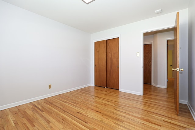 1913 Topf Rd, North Little Rock, AR 72116 - unfurnished bedroom featuring light wood-style floors and a closet