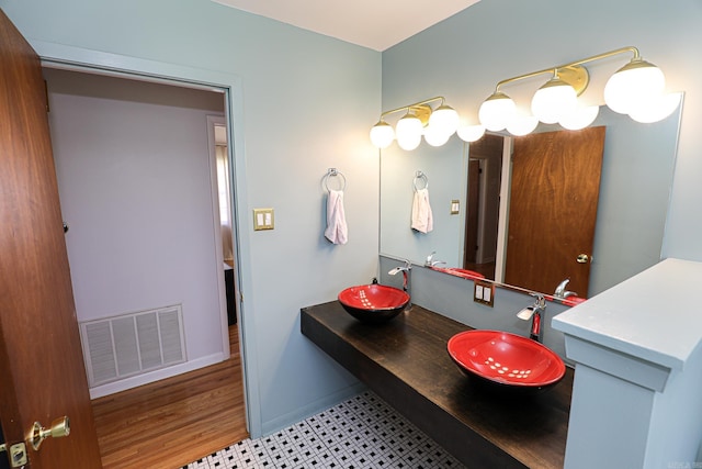 1913 Topf Rd, North Little Rock, AR 72116 - bathroom featuring double vanity and baseboards