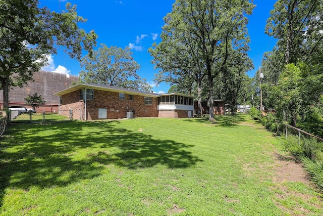 1913 Topf Rd, North Little Rock, AR 72116 - fenced backyard with a sunroom and a gate