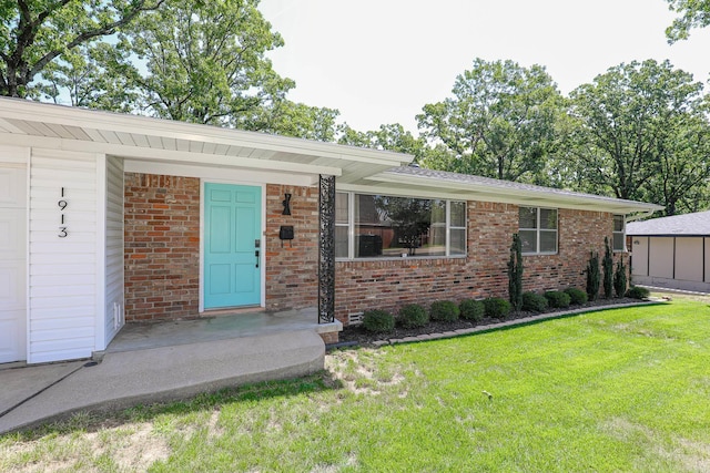 1913 Topf Rd, North Little Rock, AR 72116 - view of front of house with a front yard and brick siding
